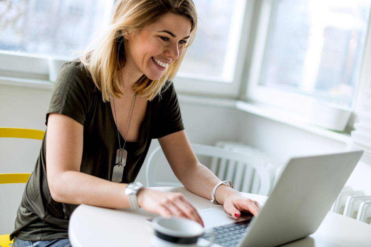 Smiling woman in front of computer